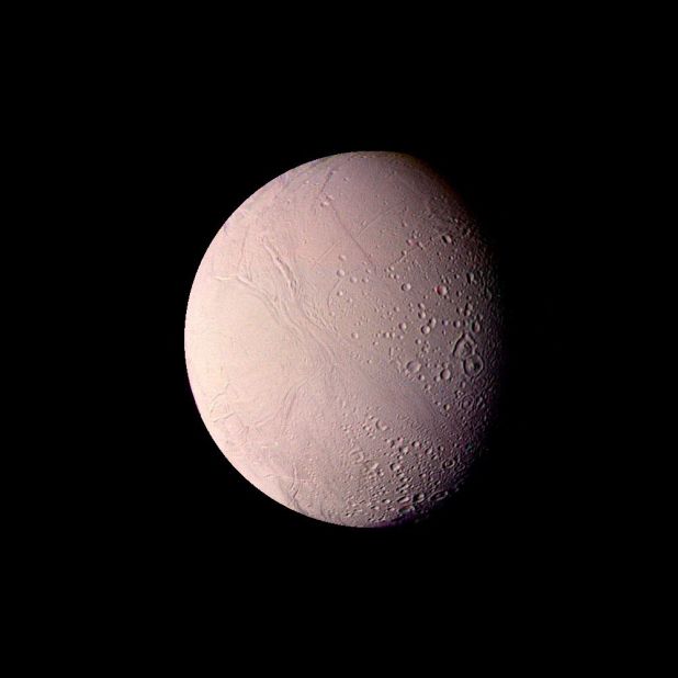 This image of Saturn's moon Enceladus shows impact craters up to 22 miles in diameter, as well as smooth uncratered areas. 