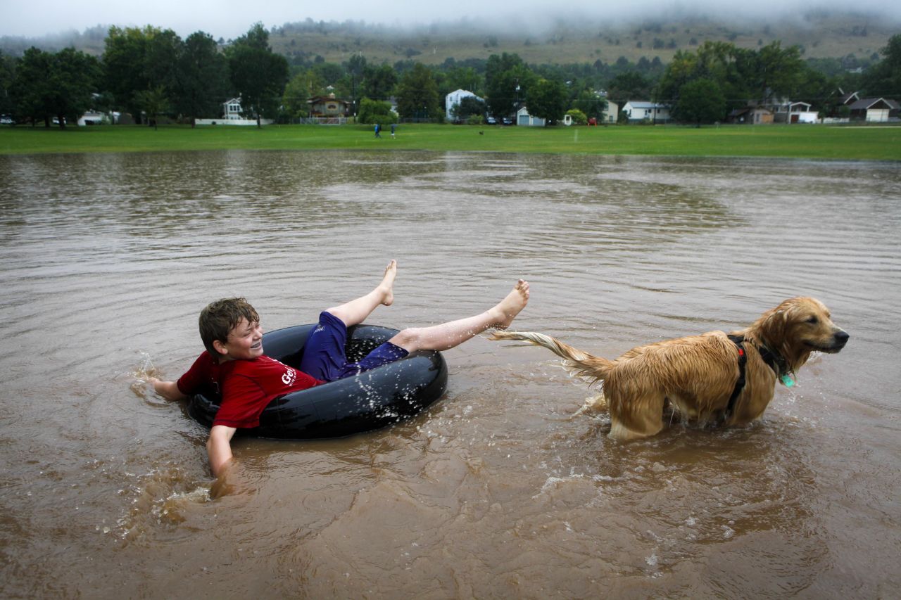 Nicky Toor, 15, floats on the flooded lawn of North Boulder Park in Boulder on September 12.