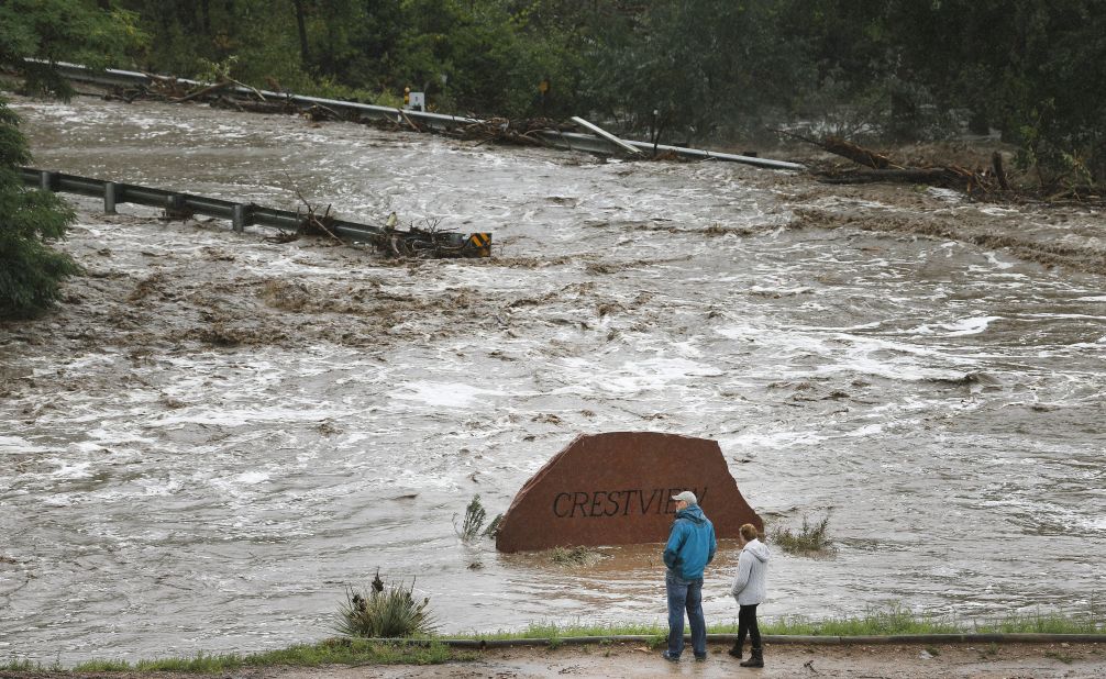 Residents view a road washed out by a torrent of water after overnight flash flooding near Left Hand Canyon, Colorado, on September 12.