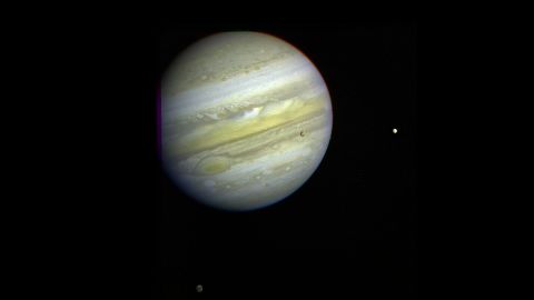 Jupiter, its Great Red Spot and three of its four largest satellites are visible in this photo taken February 5, 1979, by Voyager 1.