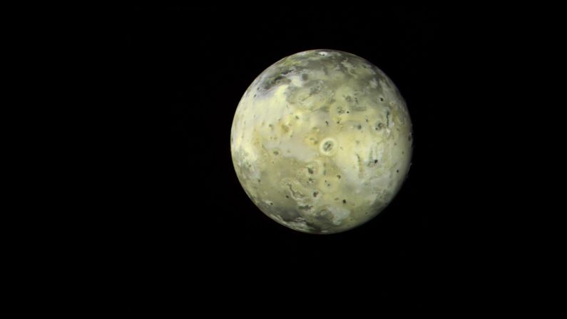This mosaic image of Jupiter's moon "Io" shows a variety of features that appear linked to the intense volcanic activity. The circular, doughnut-shaped feature in the center has been identified as a known erupting volcano.