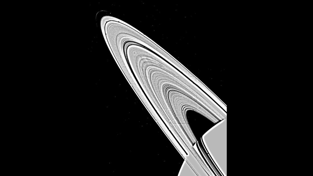 A mosaic image  of Saturn's rings, taken by NASA's Voyager 1 on November 6, 1980, shows approximately 95 individual concentric features in the rings. The ring structure was once thought to be produced by the gravitational interaction between Saturn's satellites and the orbit of ring particles, but has now been found to be too complex for this explanation alone. 