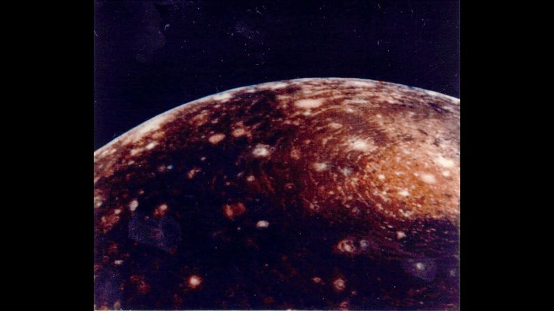 This image of Jupiter's moon "Callisto" was captured from a distance of 350,000 kilometers. The large "bull's-eye" at the top of the image is believed to be an impact basin formed early in Callisto's history. The bright center of the basin is about 600 kilometers across and the outer ring is about 2,600 kilometers across.