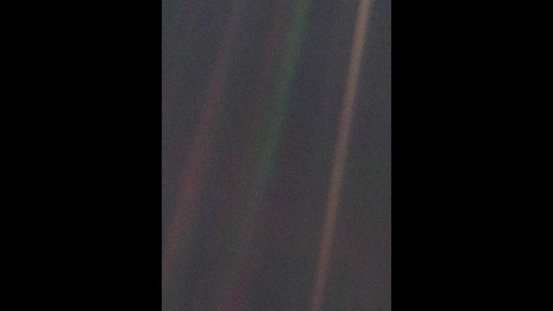 This image of the Earth, dubbed "Pale Blue Dot," is a part of the first-ever "portrait" of the solar system taken by Voyager 1.