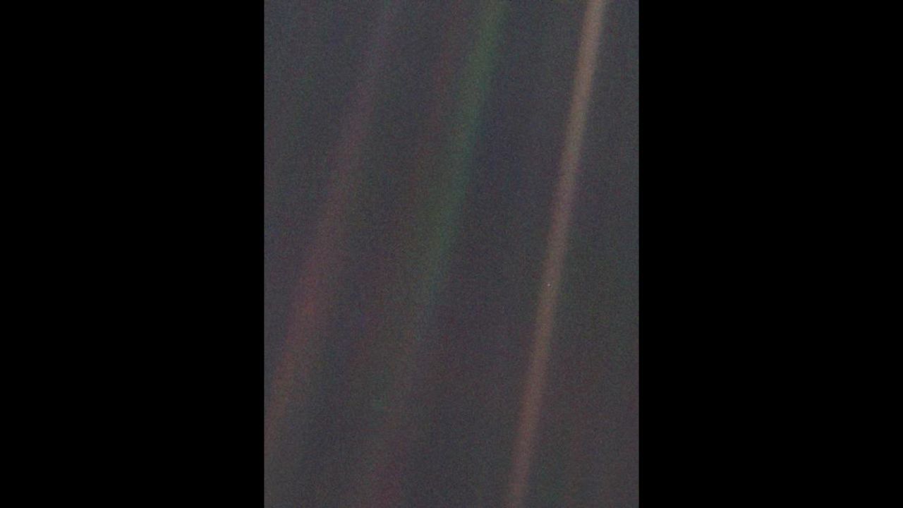 This image of the Earth, dubbed "Pale Blue Dot," is a part of the first-ever "portrait" of the solar system taken by Voyager 1.