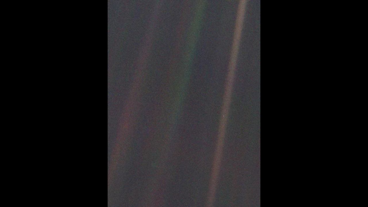 This image of the Earth, dubbed "Pale Blue Dot," is a part of the first-ever "portrait" of the solar system taken by Voyager 1.
