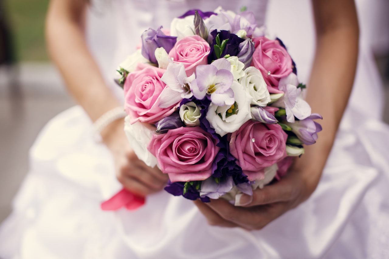 One bride says she worked out a deal with her florist to "rent" the flowers, which were collected at the end of the night and brought in to decorate local hotels and restaurants.