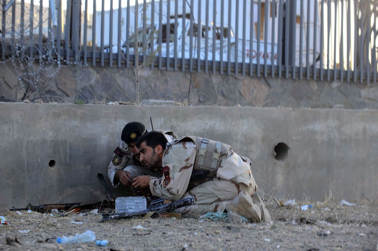 Afghanistan security forces take their position during an attack on the U.S. consulate on September 13. Gunmen staged an attack on the consulate killing two local police officers and a local security guard, police and hospital officials said. Twenty others were injured.