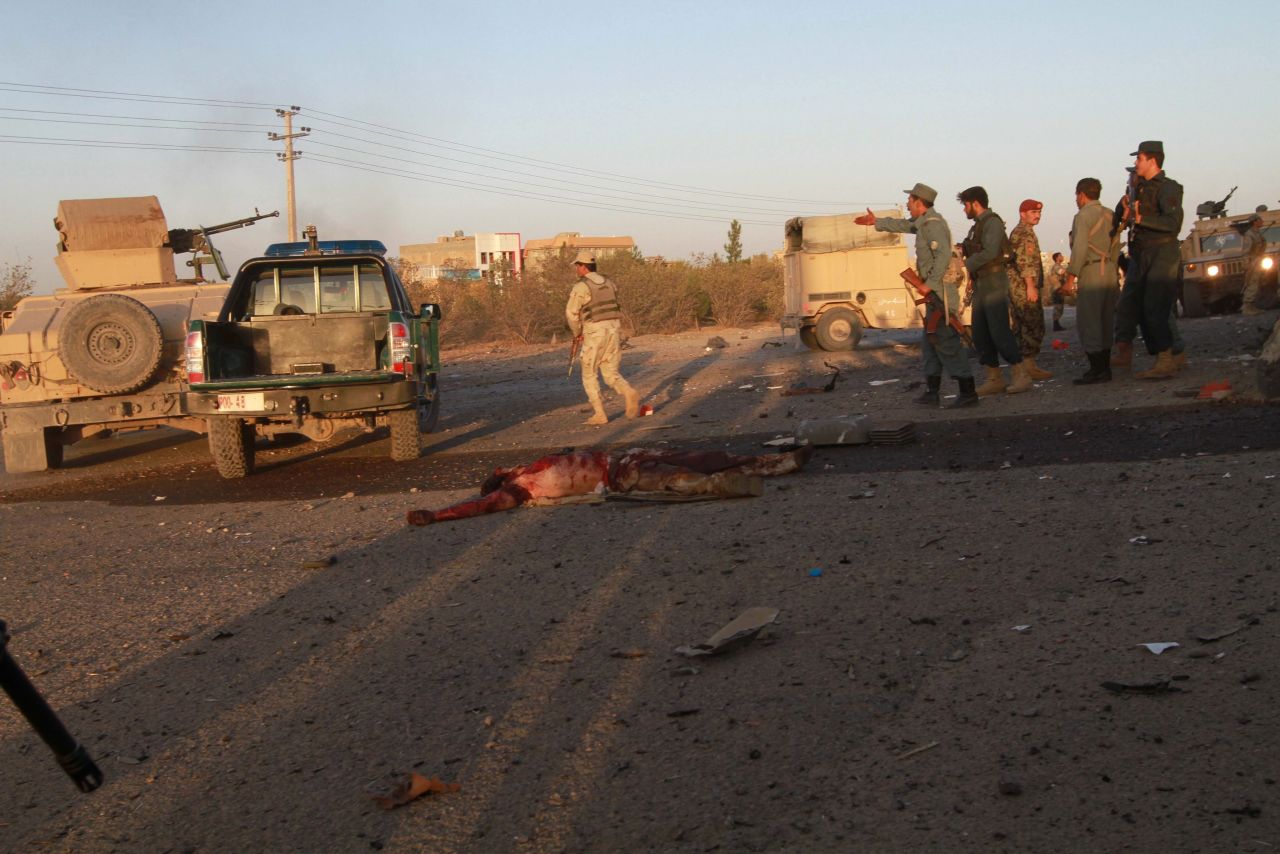 Afghan security officials inspect the scene of the attack on September 13. 