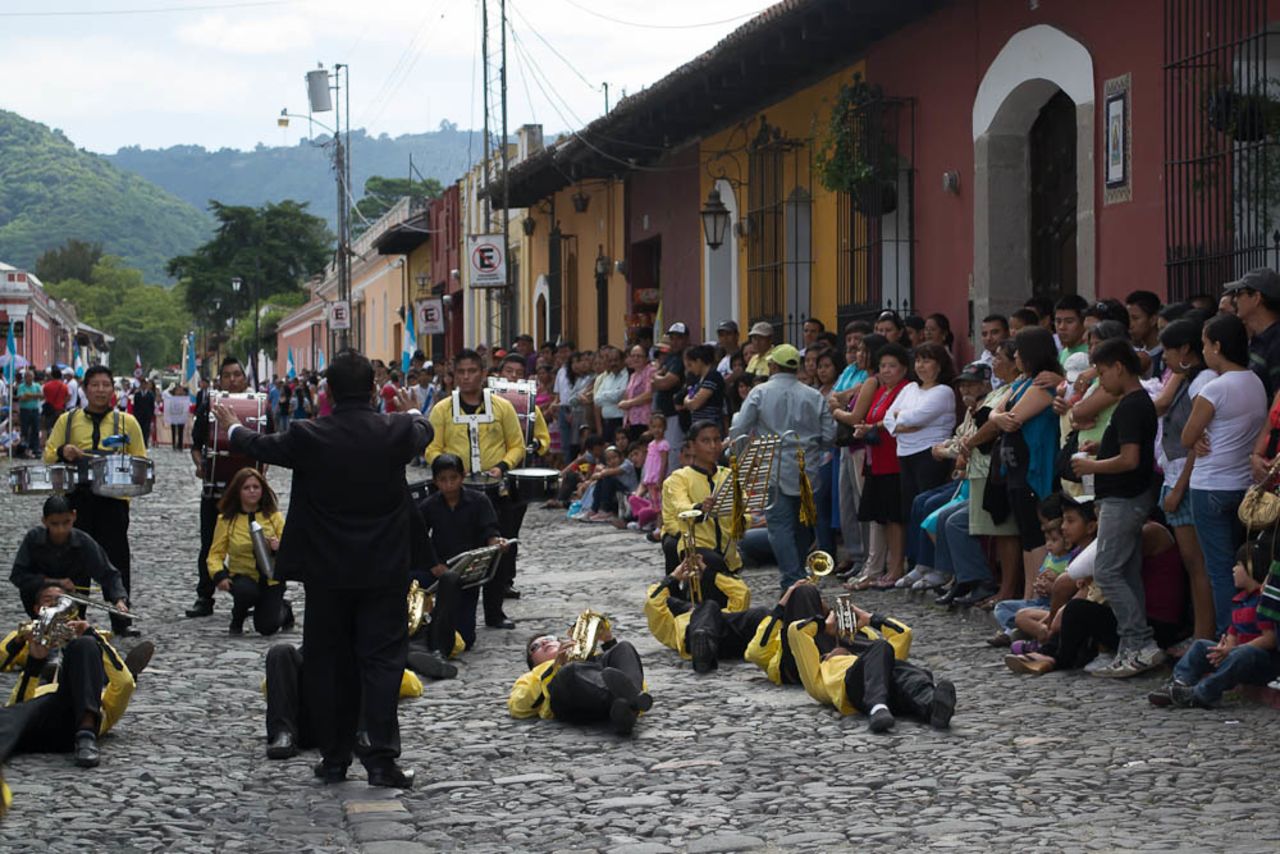 In the Independence Day parade in Antigua, Guatemala there are a lot of <a href="http://ireport.cnn.com/docs/DOC-1024299" target="_blank">marching bands</a>. "They take the choreography as seriously as the music. This particular band was unique. Lying down isn't common and was just part of this band's performance. I just happened to arrive at the spot when they were doing that part of their routine," said Alana McConnon, from Australia who is currently living in Guatemala. "The music is generally marching music, though often modern pop tunes are performed as well, all with a heavy focus on the percussion," she added. 