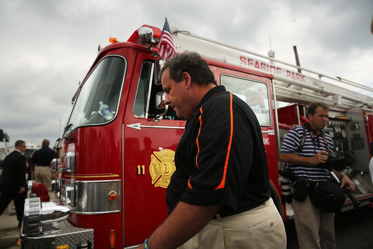 New Jersey Gov. Chris Christie explores the fire scene in Seaside Heights, New Jersey, on September 13. "I feel like I want to throw up," Christie said when he arrived at the damaged scene.