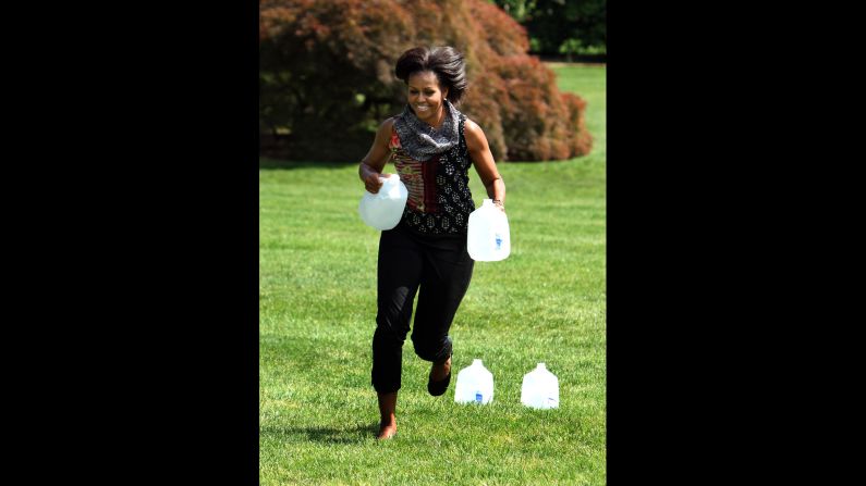 Michelle Obama runs on the South Lawn of the White House during an event announcing the creation of a military family wellness program on May 9, 2011. 