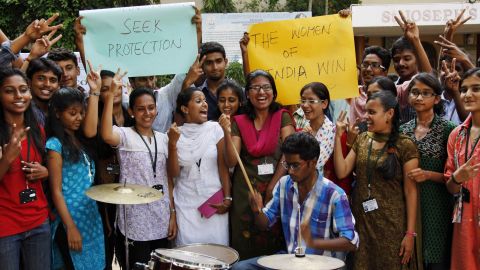 Indian students celebrate the death sentence verdict of four men who raped and murdered a woman on a bus in New Delhi last year. The students were at  a gathering in Hyderabad, India, on Friday, September 13. 