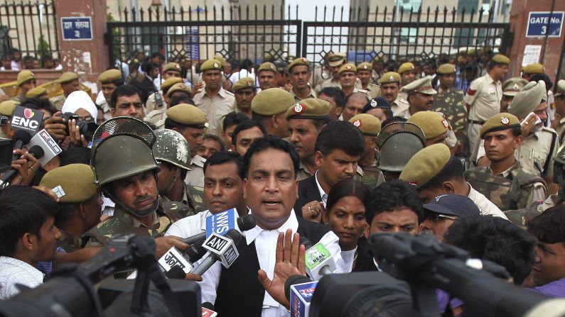 Defense lawyer A.P. Singh speaks to the media after the ruling. "This is not the victory of truth. But it is the defeat of justice," Singh shouted at the judge after hearing the death sentence.