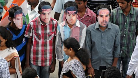 Members of the Karnataka State Youth Congress, wearing masks of the four convicted rapists, attend a demonstration after the sentencing.