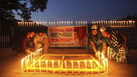 People light candles in Gauhati, India, to mark the verdict.
