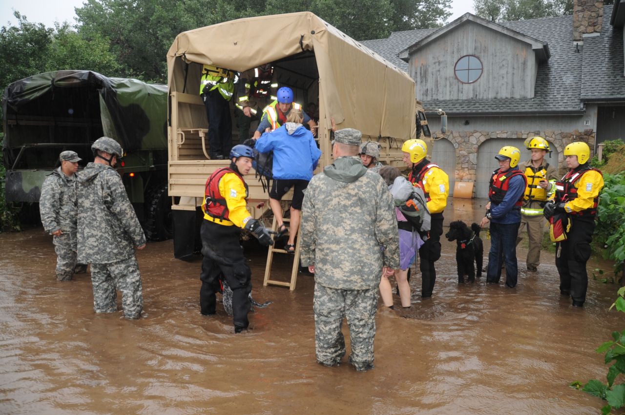 Colorado National Guardsmen assist residents in unincorporated areas of Boulder County, Colorado. Residents were evacuating the area on Thursday, September 12.