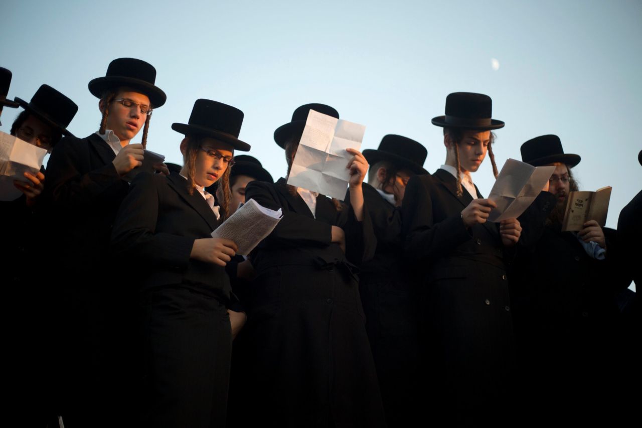 Ultra-Orthodox Jews pray on the Ayarkon River banks as they participate in a Tashlich ceremony in the ultra-Orthodox Israeli town of Ramat Gan, near Tel Aviv.