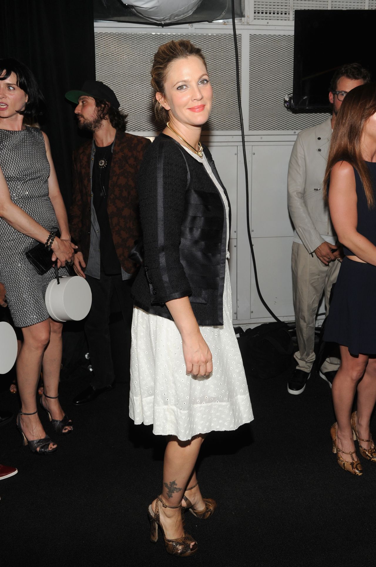 Drew Barrymore shows off her ankle tattoo backstage at the Marc Jacobs fashion show on September 12.