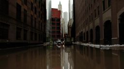 Following Hurrican Sandy water floods a street in lower Manhattan, New York, on October 30, 2012.