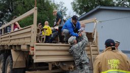 Members of the Colorado National Guard assist Boulder Country authories in evacuating residents of Lyons, Colorado to Longmont Colorado on Friday, September 13, 2013.  Flash floods have hit the area hard, washing out roads, damaging bridges and destroying homes.