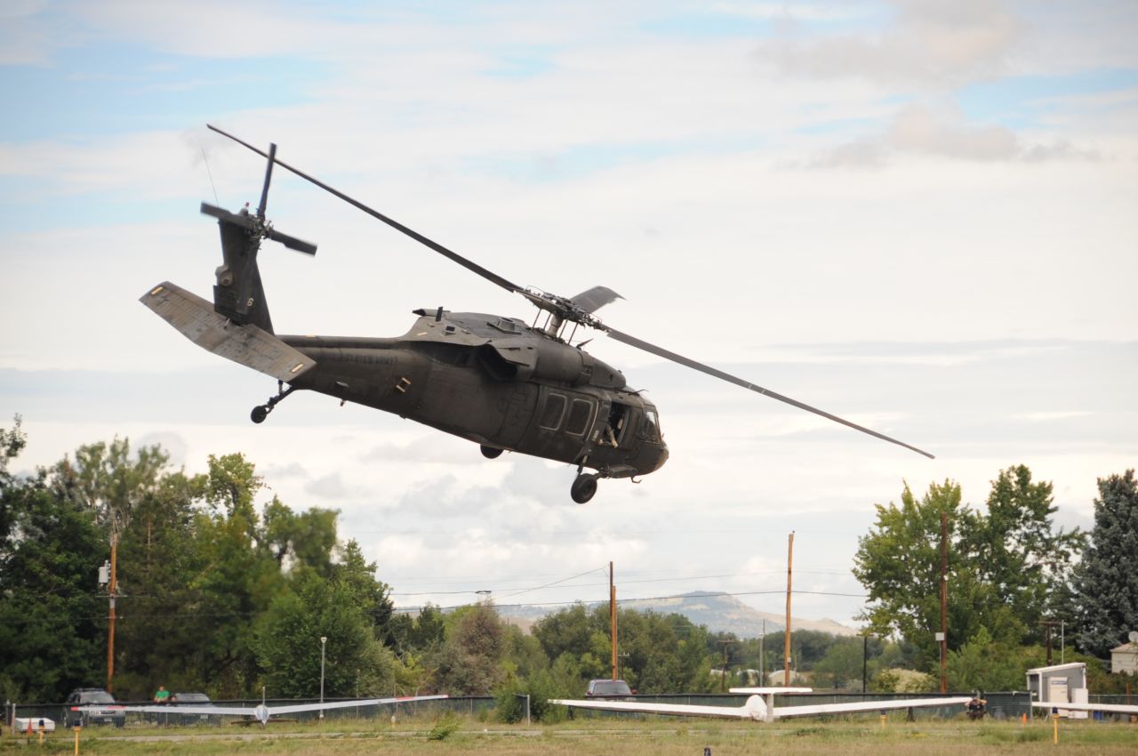 A Colorado Army National Guard helicopter takes off from the the Boulder Municipal Airport in Boulder, Colorado, on September 13.