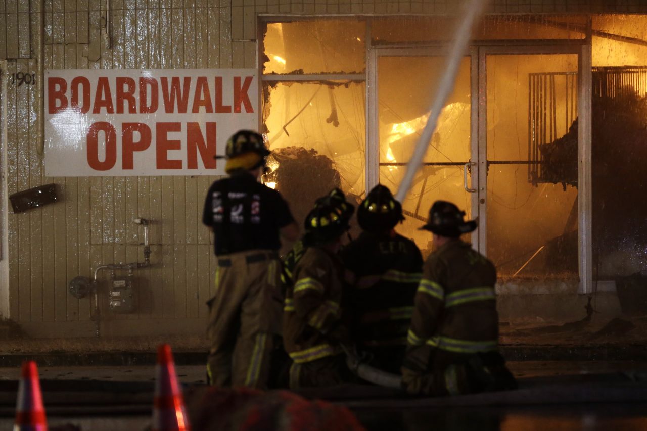 Firefighters battle a blaze in a building on the boardwalk on September 12.