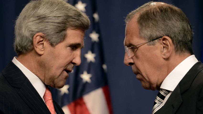 US Secretary of State John Kerry (L) speaks with Russian Foreign Minister Sergey Lavrov (R) before a press conference in Geneva on September 14, 2013 after they met for talks on Syria's chemical weapons. Washington and Moscow have agreed a deal to eliminate Syria's chemical weapons, Kerry said after talks with Lavrov.
