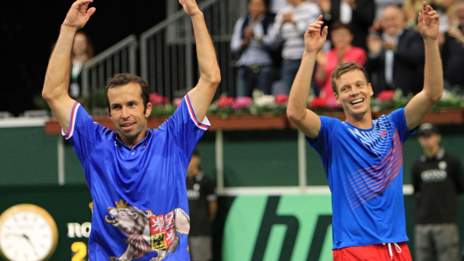 Tomas Berdych (R) and Radek Stepanek (L) celebrate after securing a 3-0 win for the Czech Republic over Argentina in Prague.