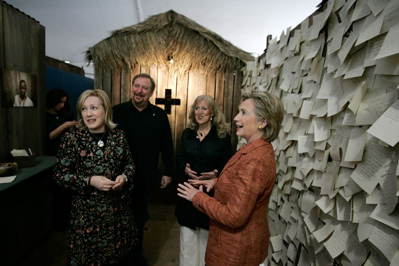 Hillary Clinton, right, then a Democratic presidential candidate, views an AIDS exhibit at the third annual Global Summit on AIDS and the Church at Warren's Saddleback Valley Community Church on November 29, 2007. All the presidential candidates were invited to attend the summit, but Clinton was the only one to attend in person.