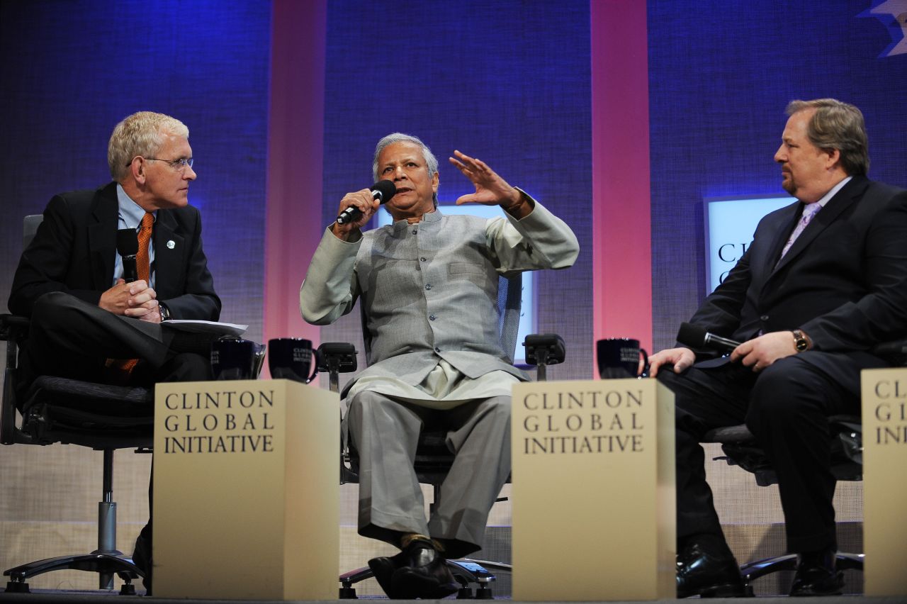 Warren, right, attends the Clinton Global Initiative on September 26, 2008, in New York with  Steve Gunderson, left, president and CEO of the Council on Foundations, and Muhammad Yunus, the founder and managing director of the Grameen Bank. The three-day event aimed to bring together global leaders to develop and implement workable solutions to some of the world's most pressing challenges.