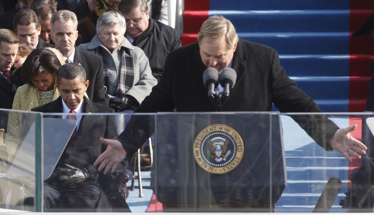 Warren gives the invocation as President-elect Barack Obama and Michelle Obama bow their heads during swearing-in ceremonies at the U.S. Capitol on January 20, 2009.