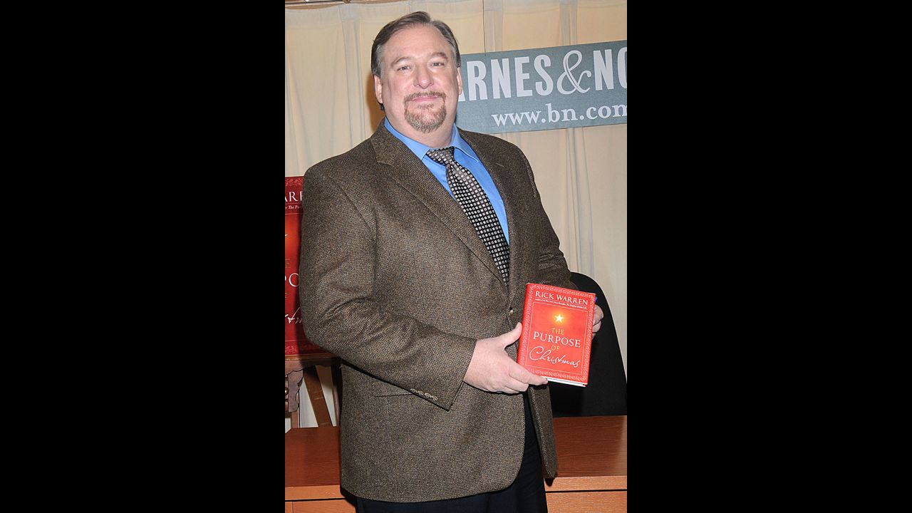 Warren poses with a copy of his book "The Purpose of Christmas" during a book-signing in 2008 in New York. 