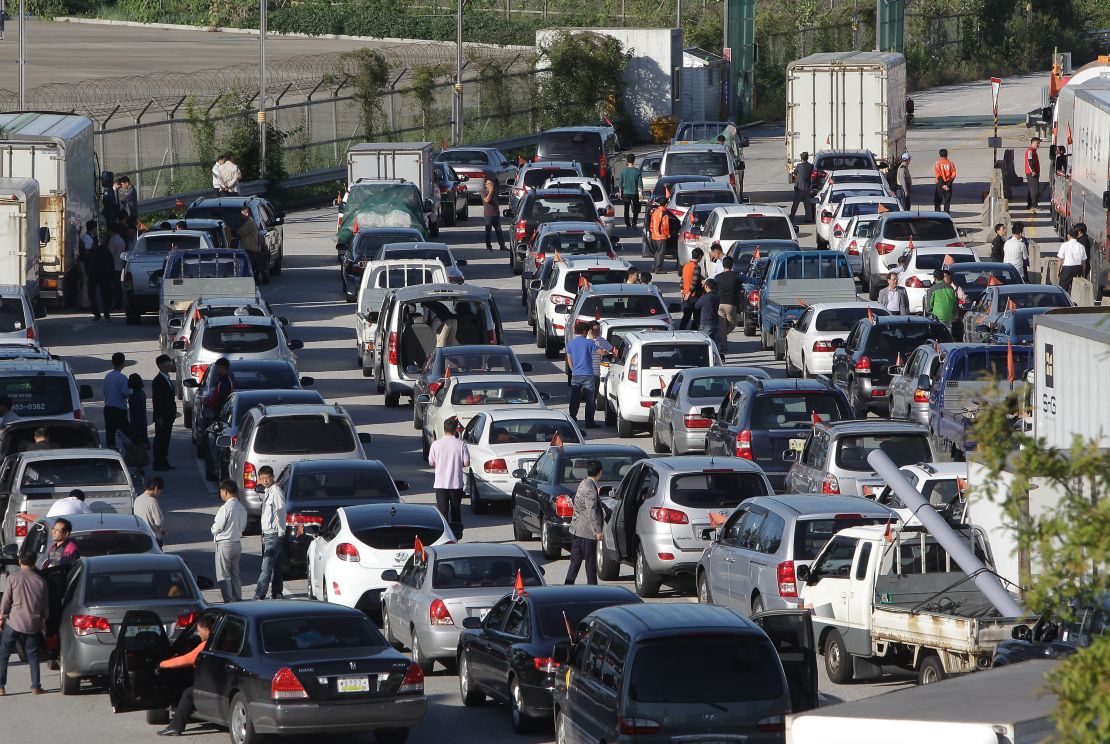 South Korean owners and workers wait in traffic to cross into Kaesong.