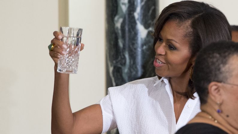 Michelle Obama raises her glass to toast during an official dinner at the State House in Dar es Salaam, Tanzania, on July 1.