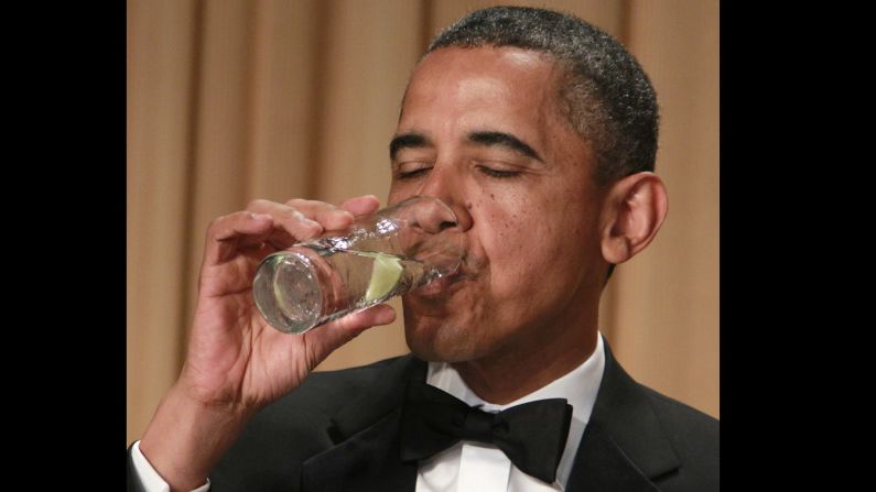 Obama drinks water at the White House Correspondents' Association dinner on  April 28, 2012, in Washington. 