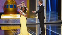 ATLANTIC CITY, NJ - SEPTEMBER 15: Miss America 2014 contestant Miss New York Nina Davuluri (in front) is crowned 2014 Miss America by 2013 Miss America Mallory Hagan during the Miss America Competition at Boardwalk Hall Arena on September 15, 2013 in Atlantic City, New Jersey. (Photo by Michael Loccisano/Getty Images)