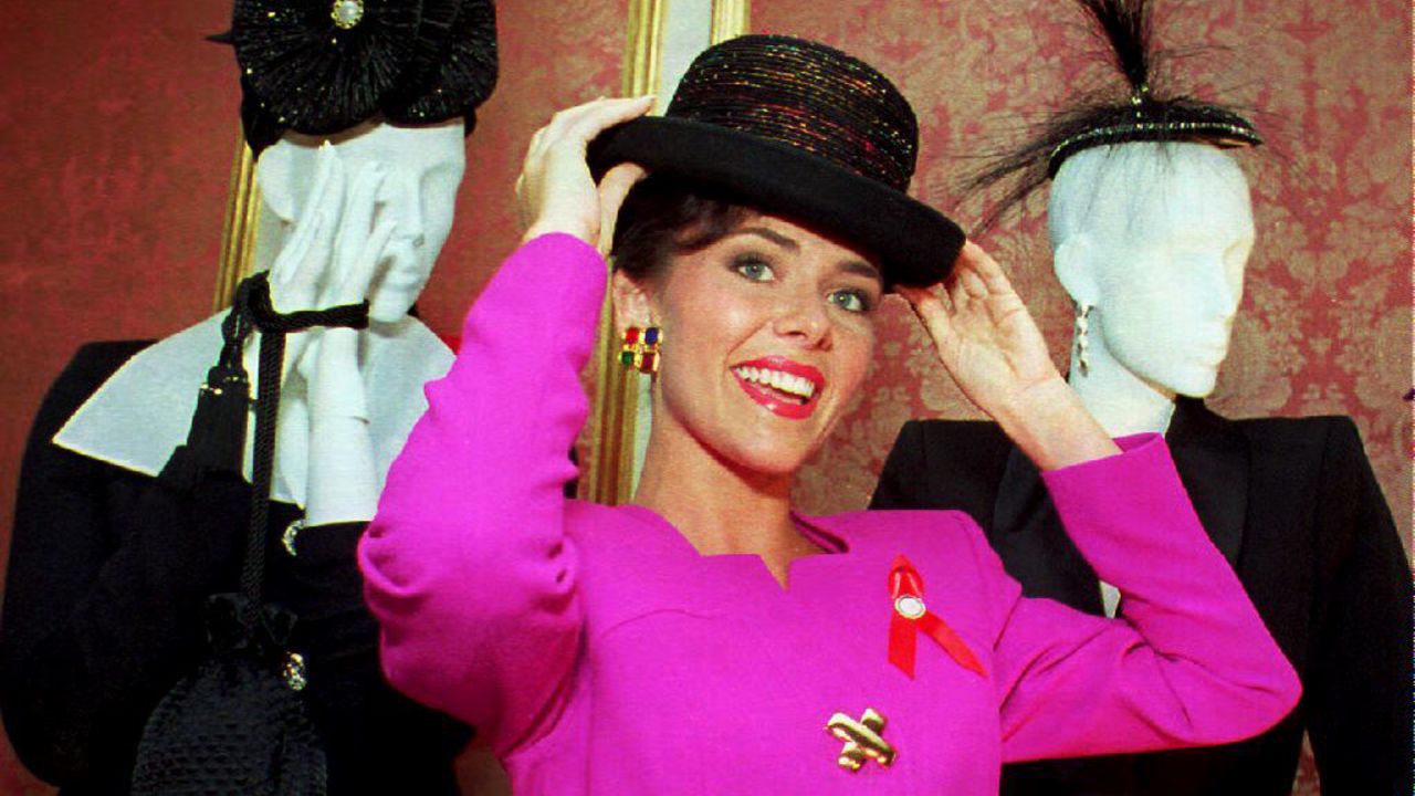 Miss America 1993, Leanza Cornett, tries on a hat in New York in 1992. Cornett announced that she would wear only U.S. fashions in support of U.S. textile and apparel workers. 