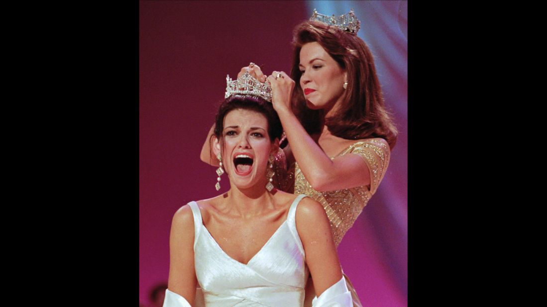 Miss Ilinois, Katherine Shindle, left, reacts as she's crowned the 1998 Miss America by Tara Holland at the Miss America Pageant in Atlantic City. 