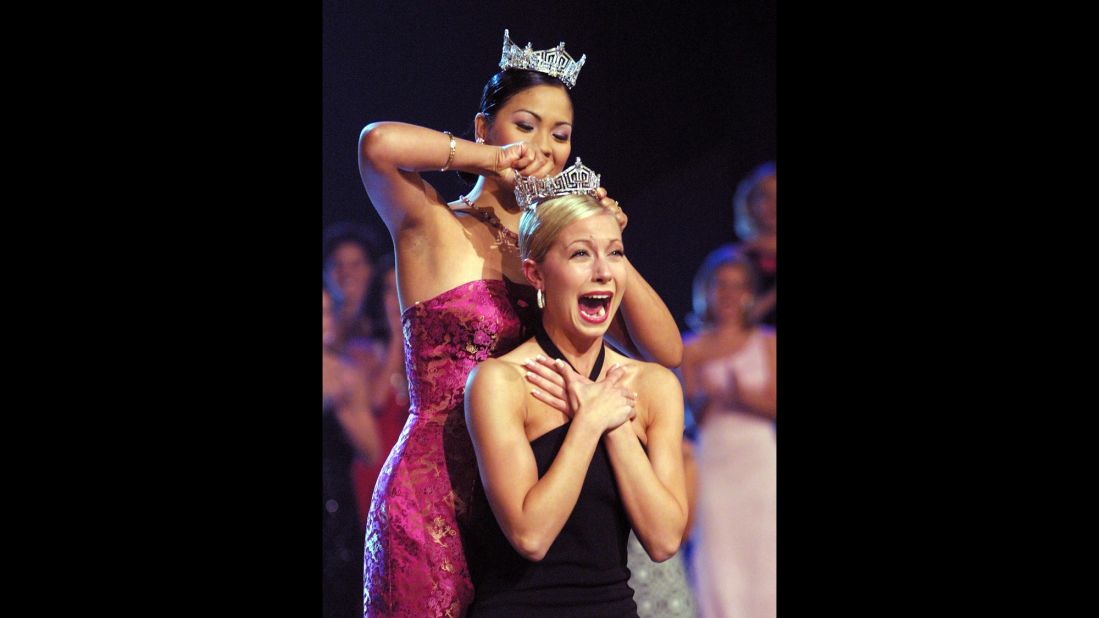 Miss America 2002, Katie Harman, clasps her hands together, overjoyed as she assumes the title of Miss America 2002. 