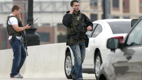 Armed agents from the Bureau of Alcohol, Tobacco, Firearms and Explosives work on the 11th Street Bridge adjacent to the Washington Navy Yard.