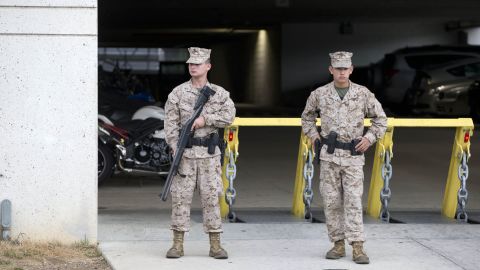 Troops stand guard in front of a parking garage near the Washington Navy Yard.