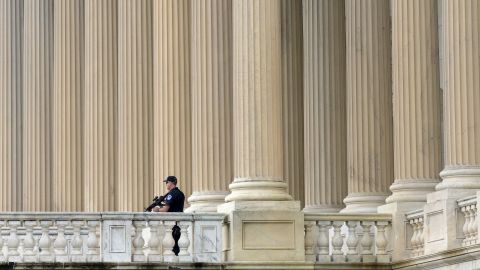 A U.S. Capitol Police officer keeps watch on the East Plaza of the Capitol in Washington.