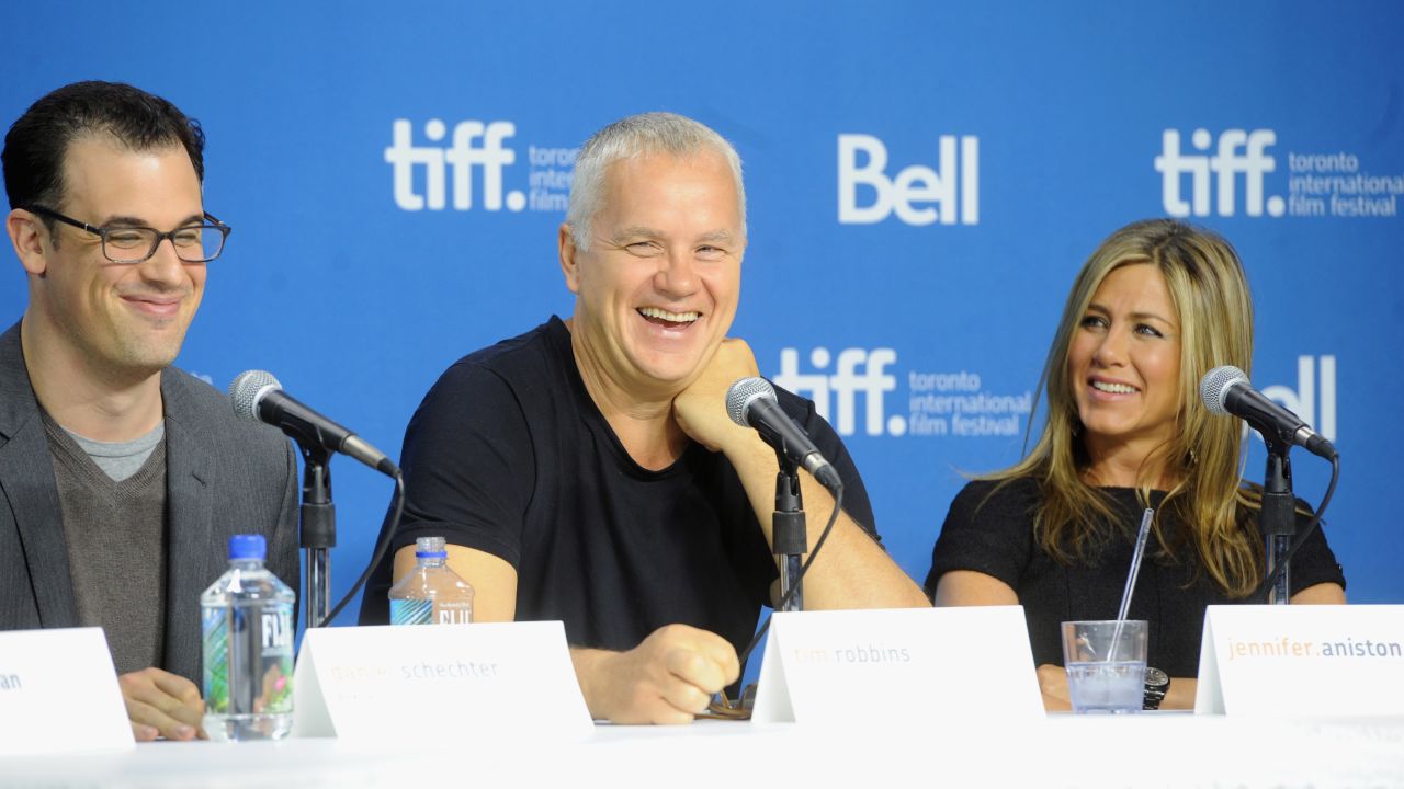 Writer/director Daniel Schechter, left, actor Tim Robbins and actress/producer Jennifer Aniston speak at the "Life of Crime" news conference on September 14.