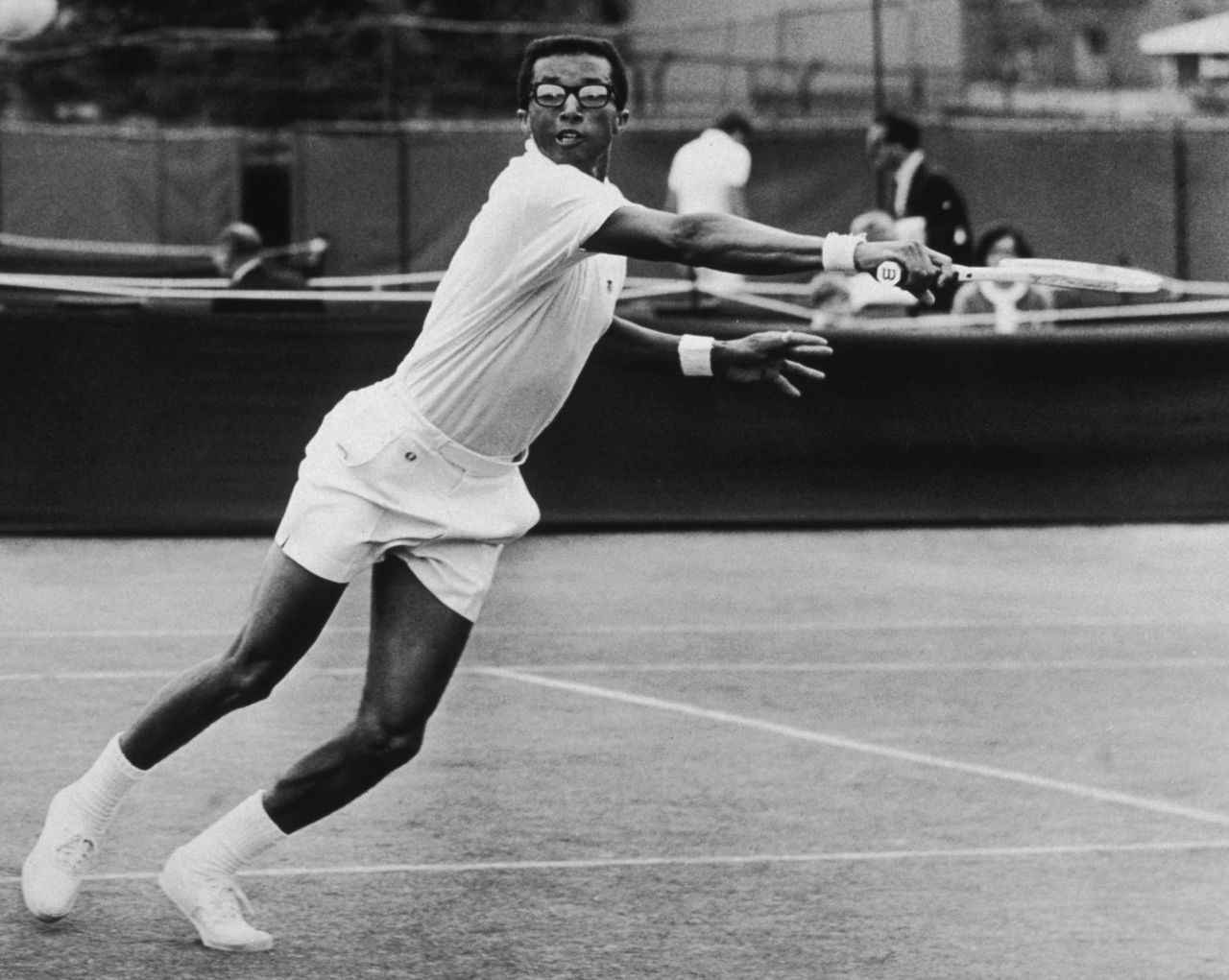 Ashe excelled on faster courts due to his serve and volley style -- as seen here at Wimbledon in 1968.