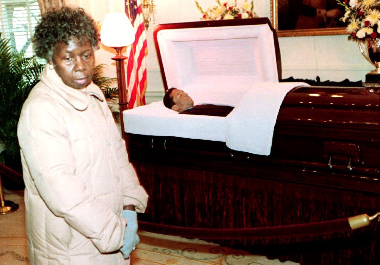 A mourner looks on as Ashe lies in state at the Governor's Mansion in Virginia before his burial on February 10, 1993.