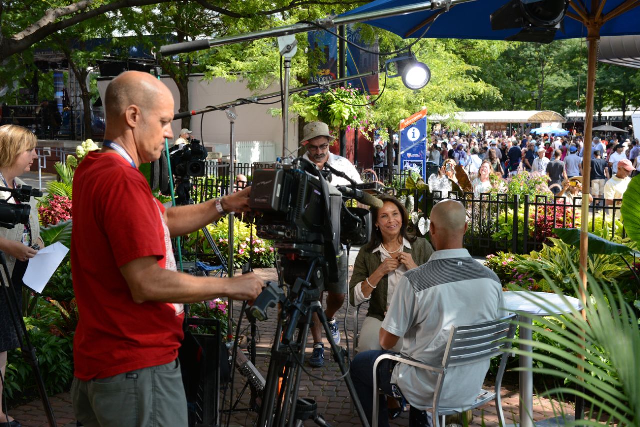 James Blake gets ready to interview Jeanne Ashe for CNN at the 2013 U.S. Open at Flushing Meadows.
