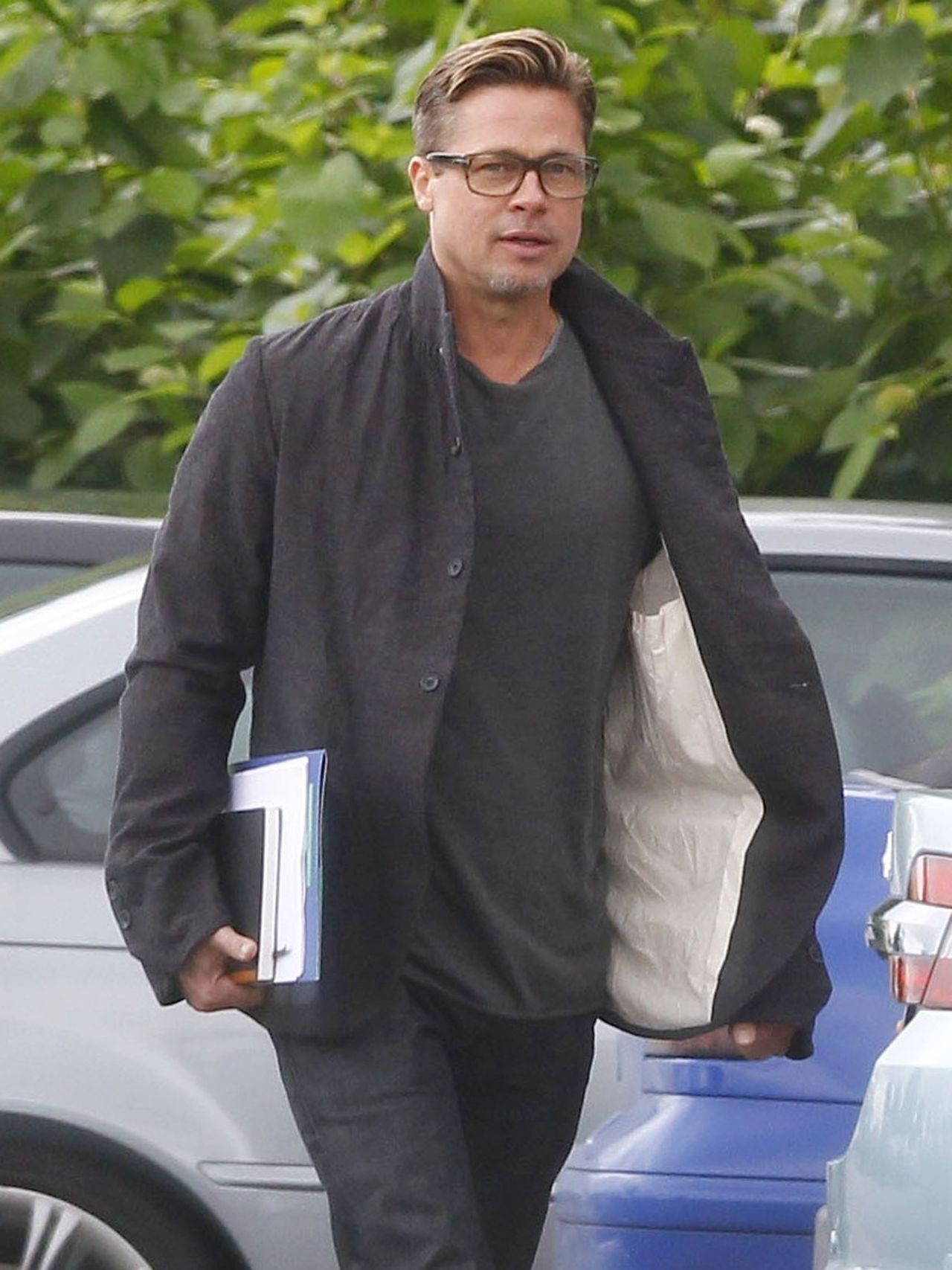 Brad Pitt shows off his shorter hair while filming in the U.K. on September 14.