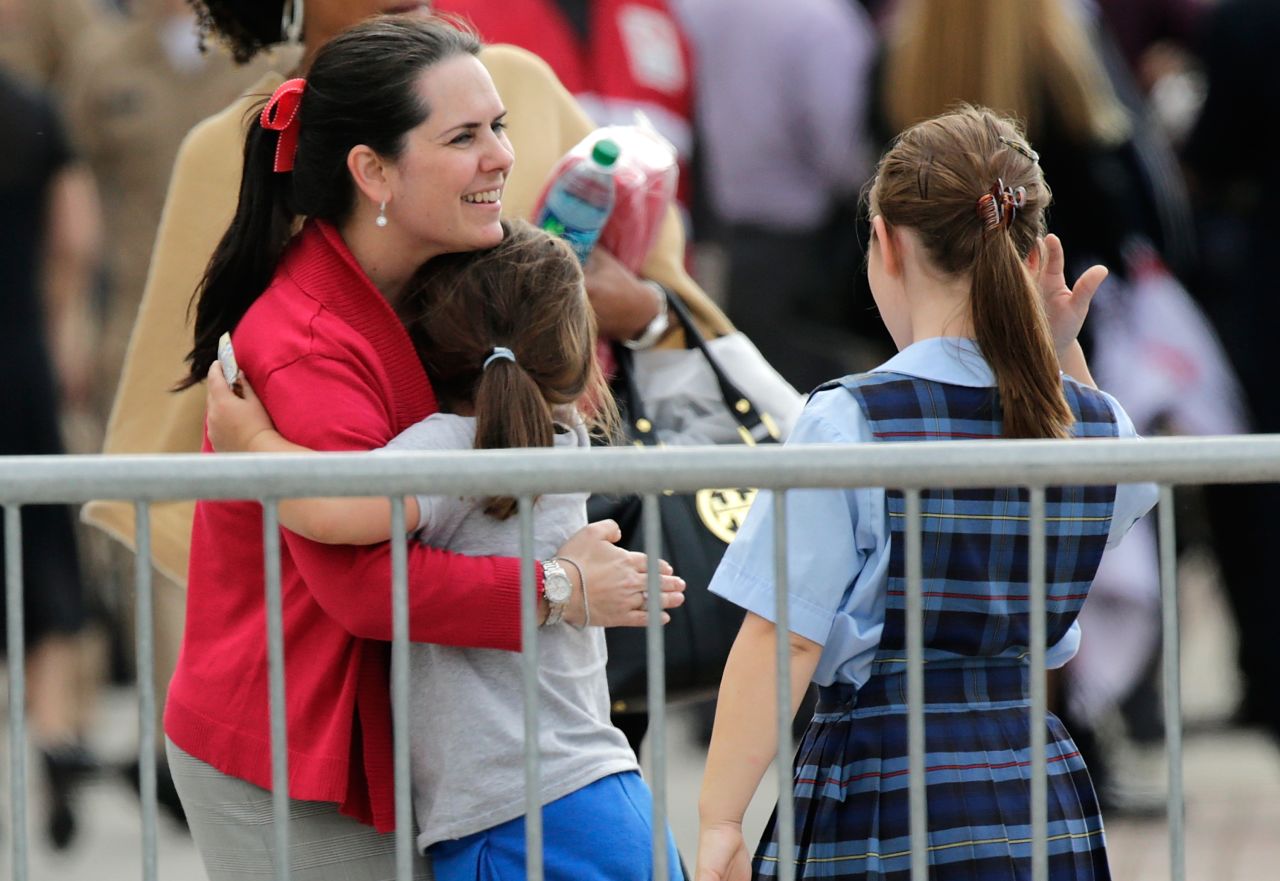 A woman reunites with her child inside Nationals Park.