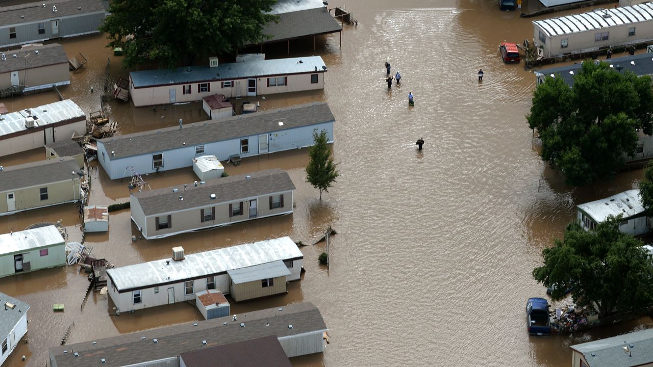 People wade through floodwater in Greeley, Colorado, on September 16.